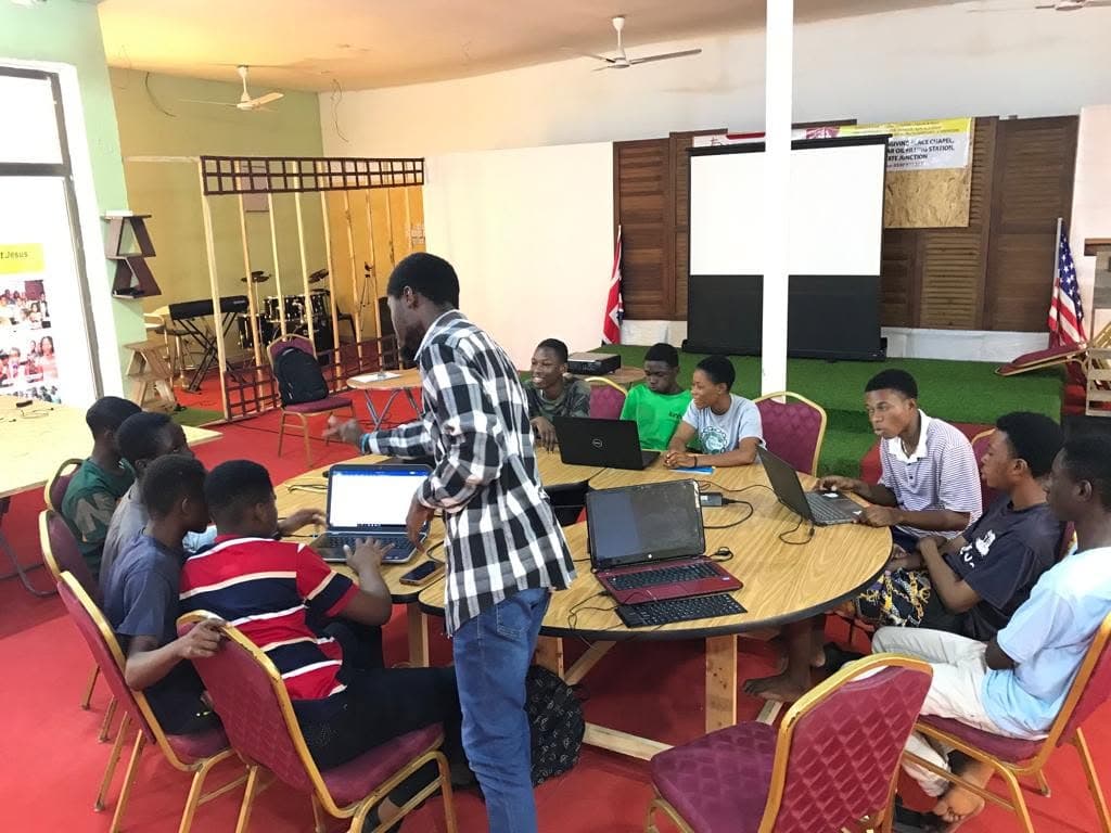 A group coding session around a table